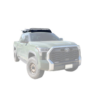 a green truck with a rack on top