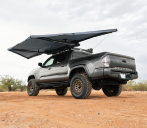 Silver Toyota Tacoma with a Tent Hooked onto a GOBI Racks Roof Rack