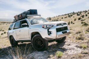 Silver Toyota 4Runner with GOBI Racks Roof Rack Driving Uphill in Off-Roading Adventure