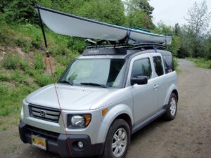 Silver Honda with a kayak attached to a GOBI Racks roof rack